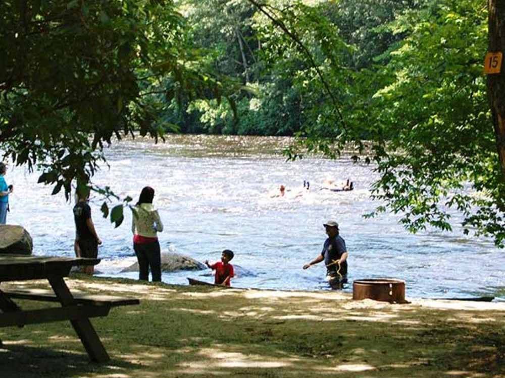 People playing on the river at HIDDEN ACRES FAMILY CAMPGROUND