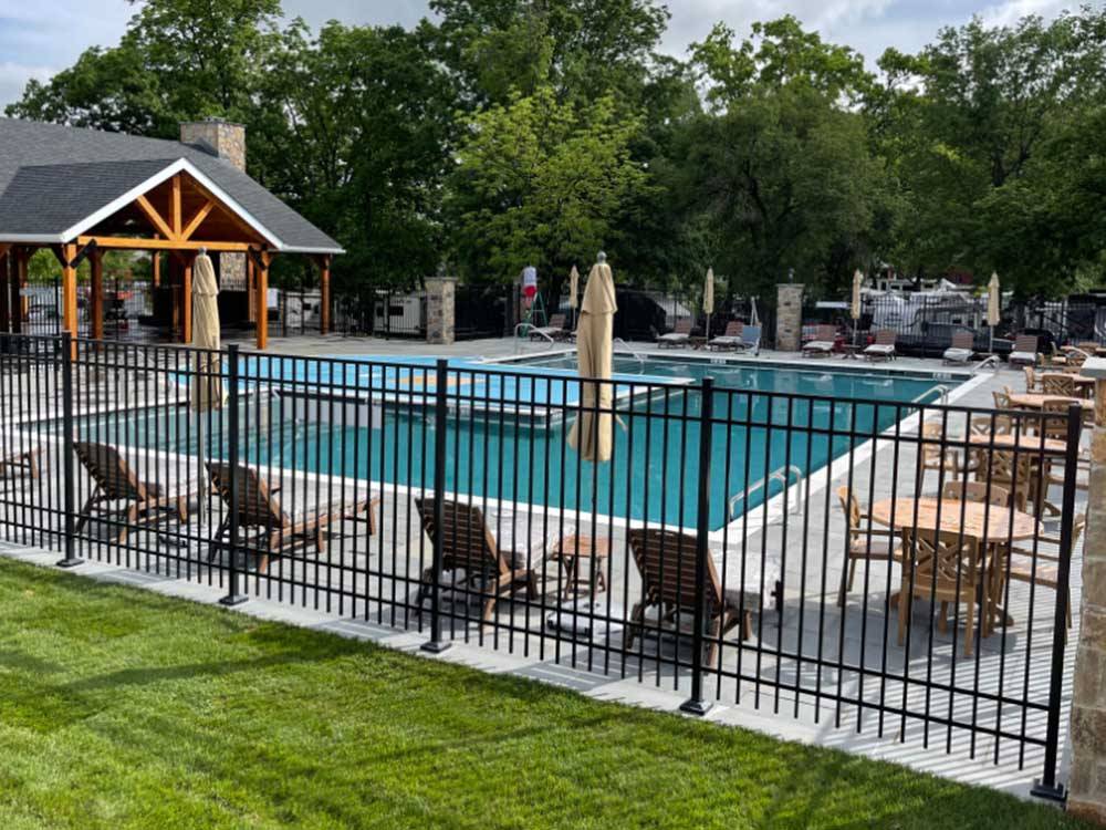 View of guest pool from behind fence at ARTILLERY RIDGE CAMPING RESORT & GETTYSBURG HORSE PARK
