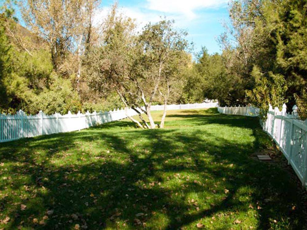 A white fenced area at WOODS VALLEY KAMPGROUND & RV PARK