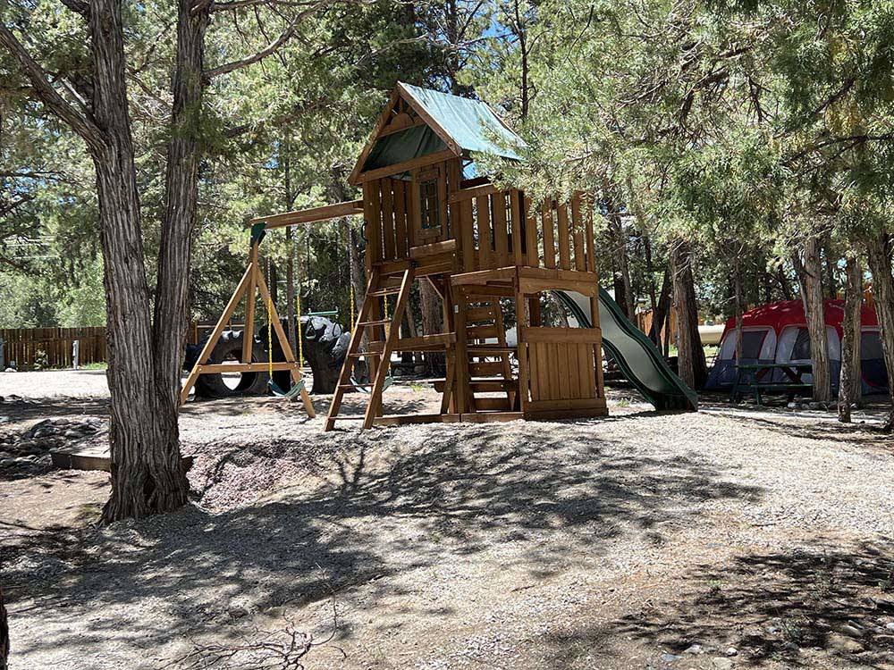 Playground with wooden play structure at SUGARBUSH CAMPGROUND