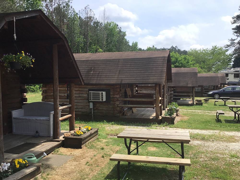 Rental cabin with table in front at Atlanta South RV Resort