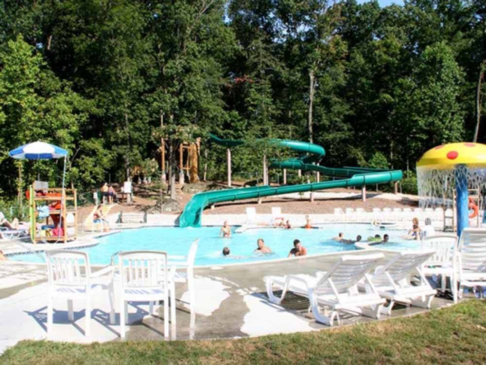 The swimming pool area with a slide at DRUMMER BOY CAMPING RESORT