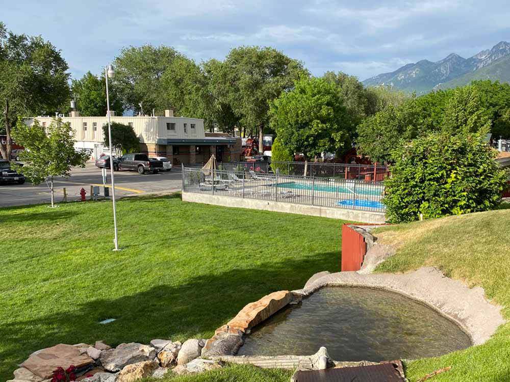 Overlooking the pool and a grassy area at MOUNTAIN SHADOWS RV PARK & MHP