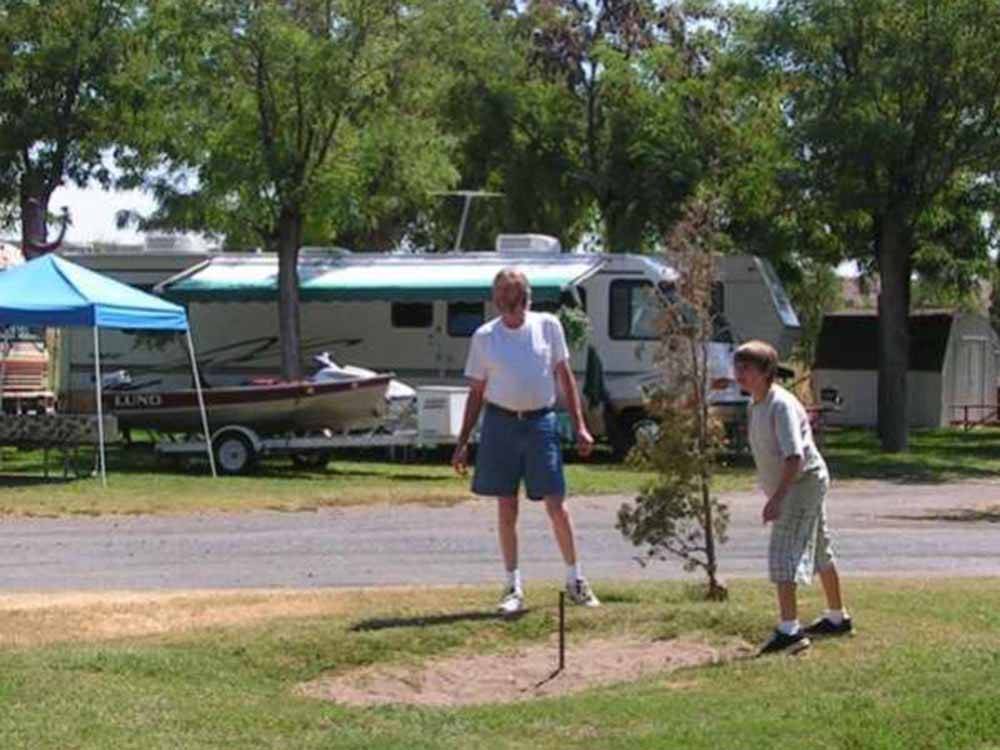 People playing horseshoes at HAT ROCK CAMPGROUND