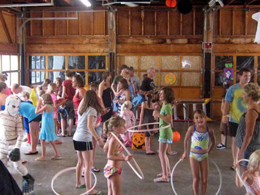 A group of kids hula hooping at LONE PINE CAMPSITES