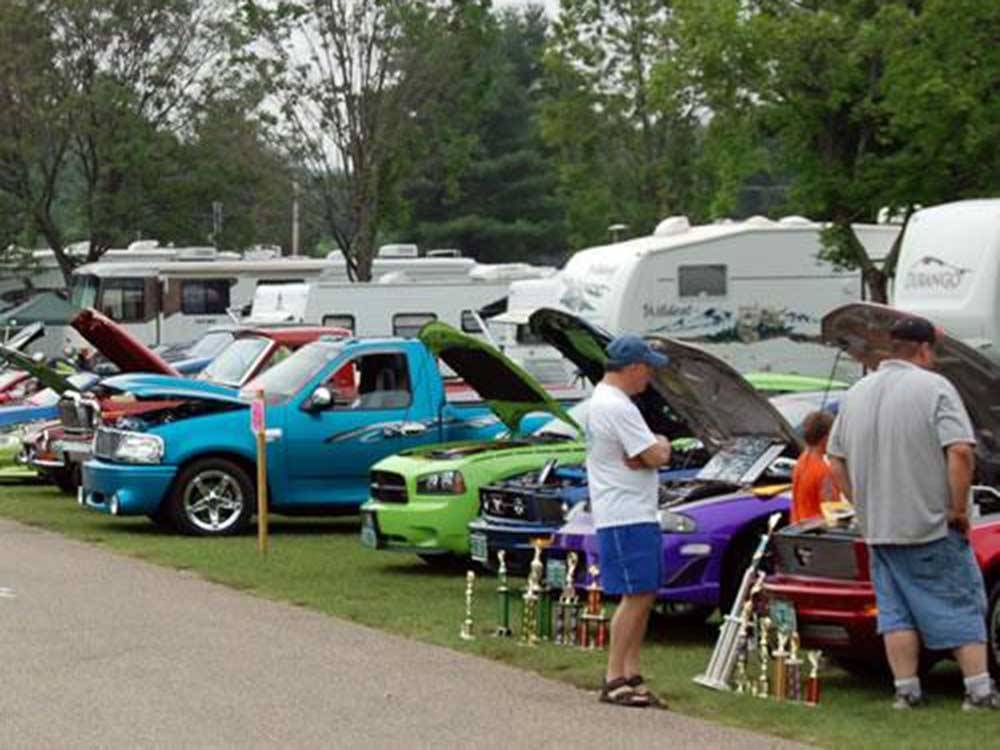 A row of classic cars at a car show at LONE PINE CAMPSITES
