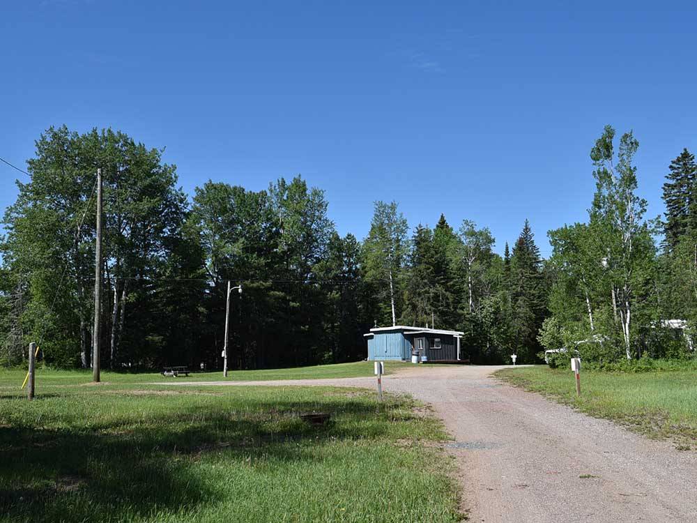 Dirt road leading to RV sites at STILLWATER TENT & RV PARK