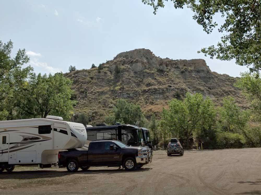 RVs parked in gravel sites at RED TRAIL CAMPGROUND