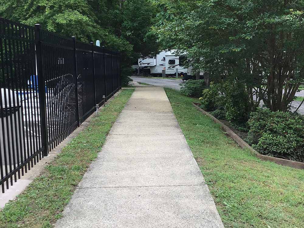 A concrete walkway by the pool at PRINCE WILLIAM FOREST RV CAMPGROUND