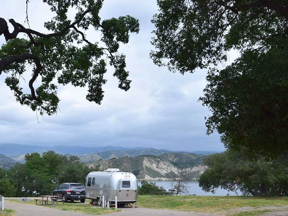 Airstream trailer parked in a site at CACHUMA LAKE CAMPGROUND