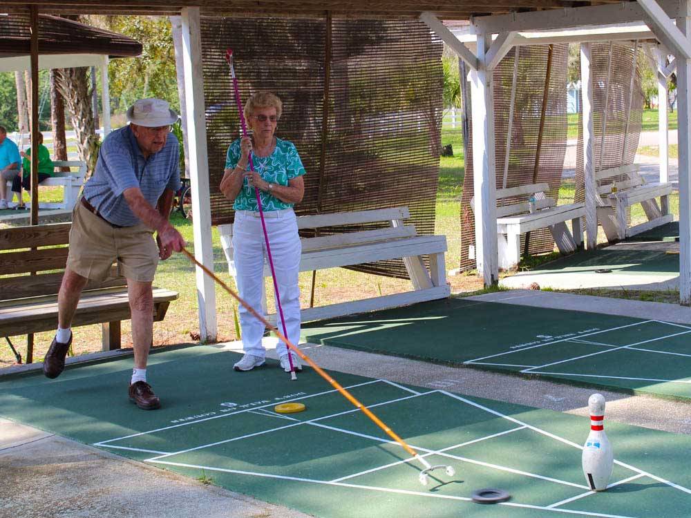 Couple playing shuffleboard at ENCORE RAMBLERS REST
