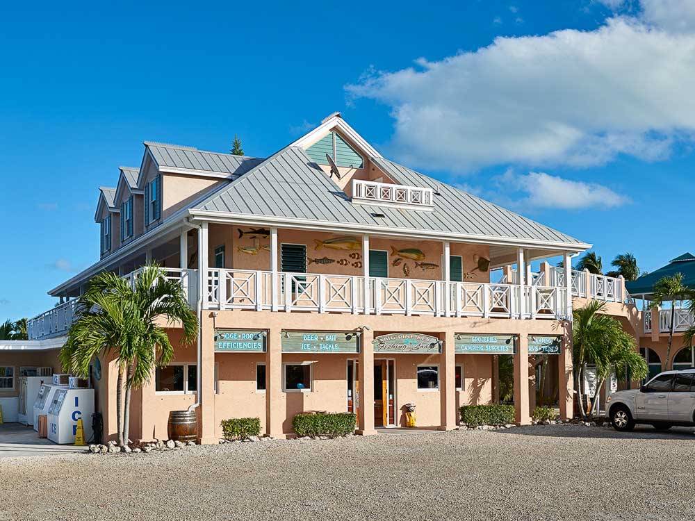 A campground building painted pastel pink with second-story balcony at BIG PINE KEY RESORT