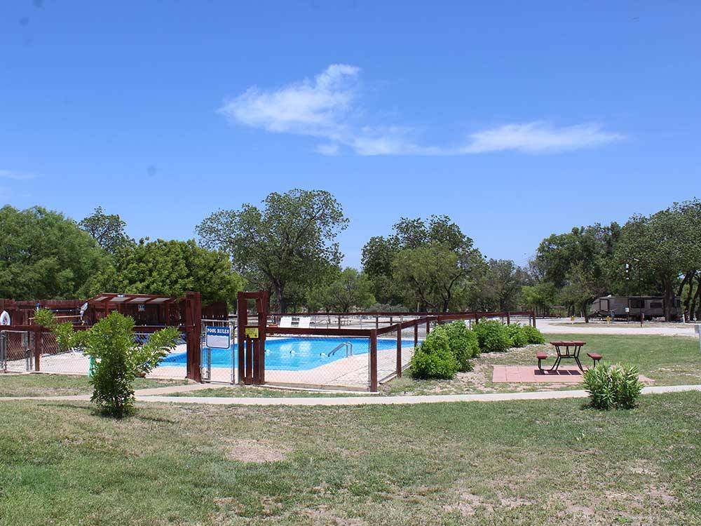 Looking at the swimming pool from a distance at NORTH LLANO RIVER RV PARK