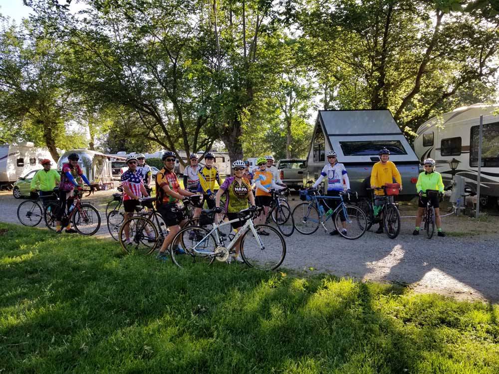 A group of people riding their bikes at THE PARKWAY RV RESORT & CAMPGROUND