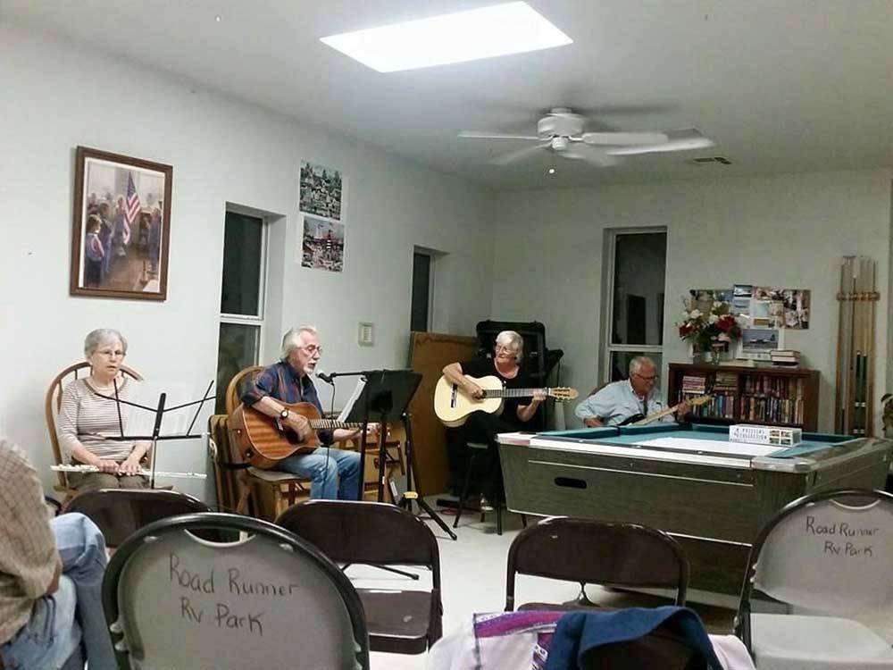 A group playing musical instruments at ROADRUNNER RV PARK OF DEMING