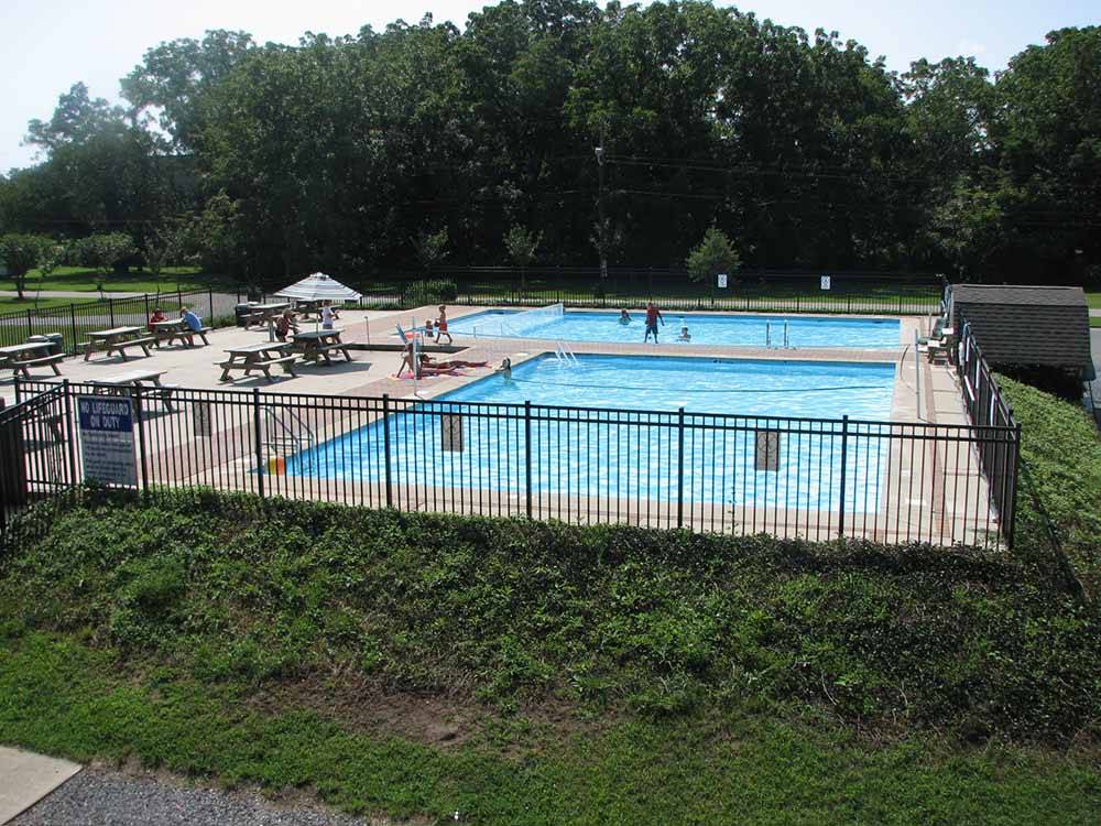 The fenced in swimming pool at ACORN CAMPGROUND
