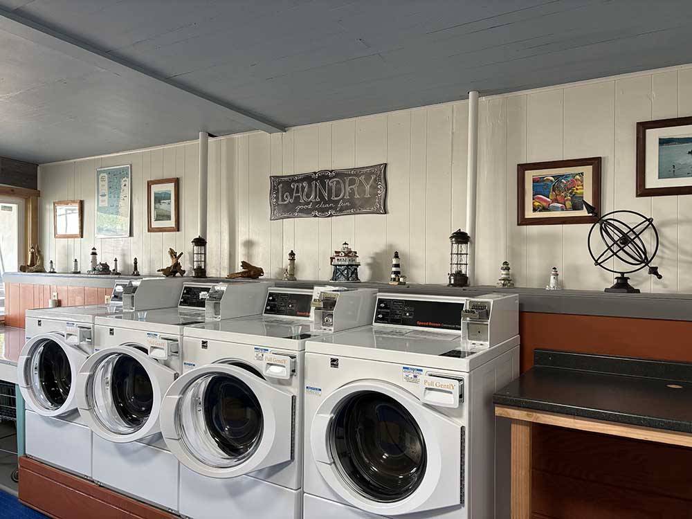 Four washing machines in the laundry room at Port Orford RV Village