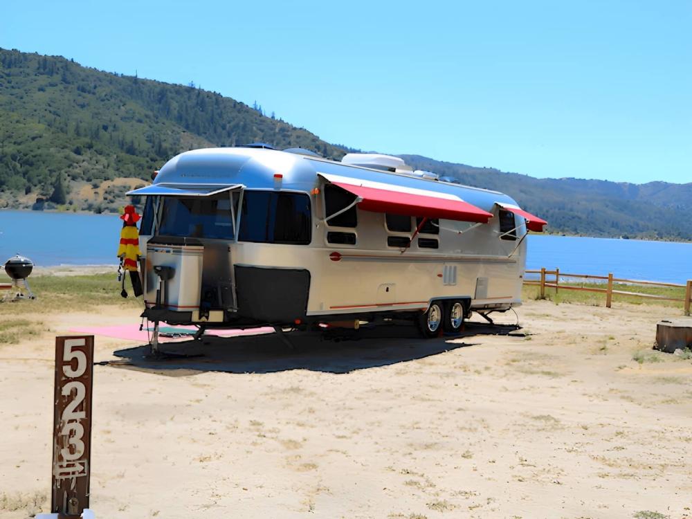 An RV parked in a lakefront site
