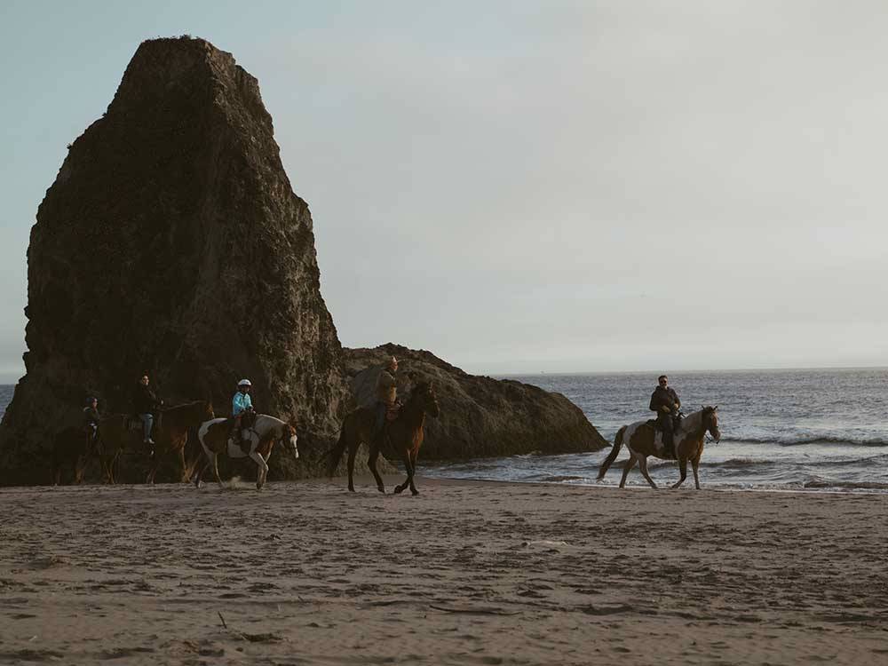 People on horseback on the beach at BANDON RV PARK