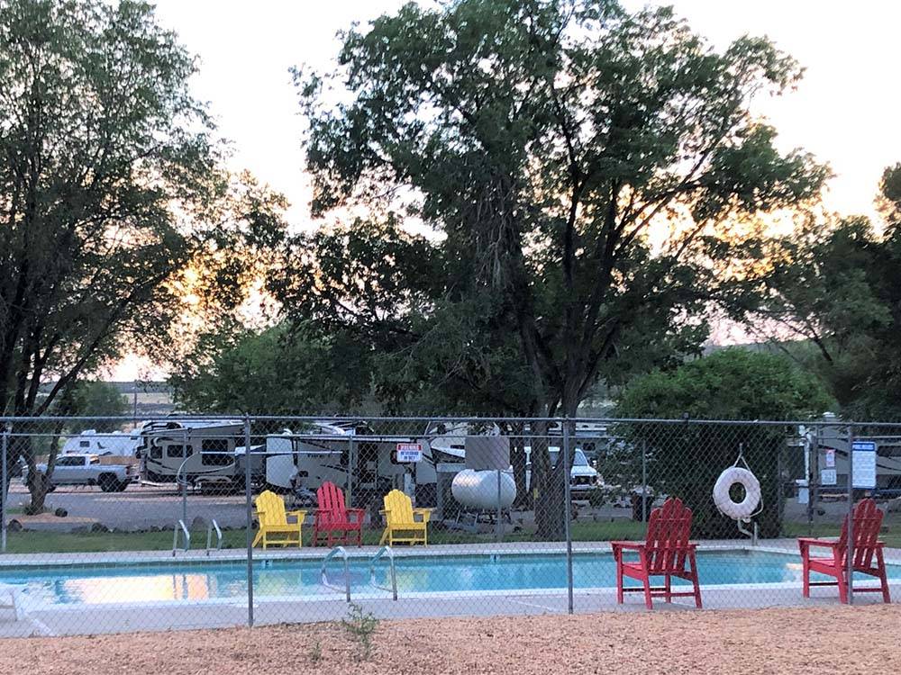 The fenced in swimming pool at DIXIE FOREST RV RESORT BY RJOURNEY