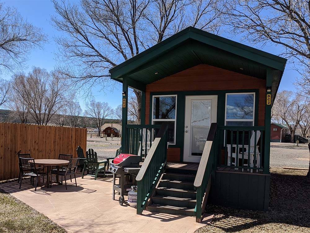 A rental cabin with a deck at DIXIE FOREST RV RESORT BY RJOURNEY