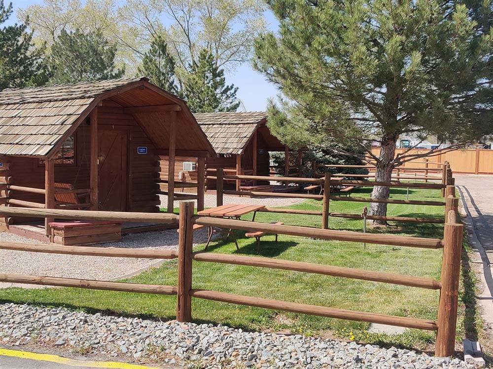 Rental cabins with picnic benches at CEDAR CITY RV RESORT BY RJOURNEY