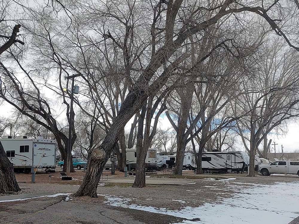 Motorhomes parked with snow on the ground at CEDAR CITY RV RESORT BY RJOURNEY