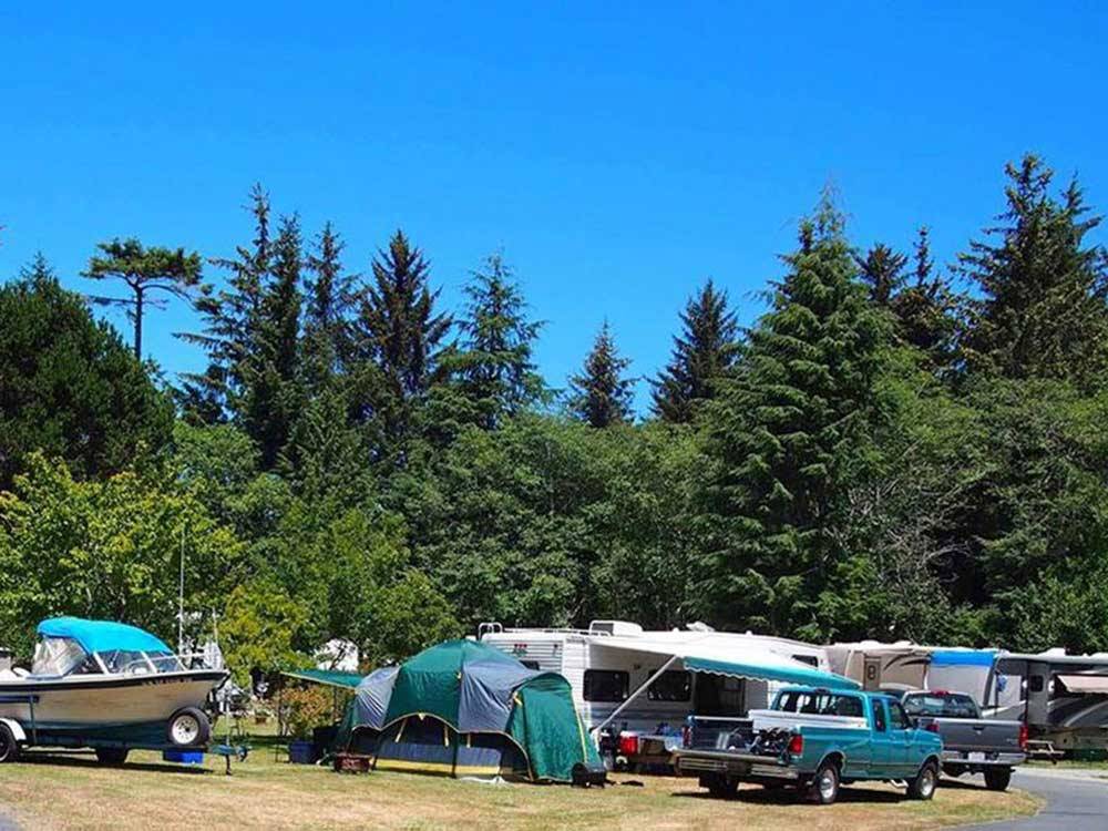 Trailers and RVs camping at VILLAGE CAMPER INN RV PARK