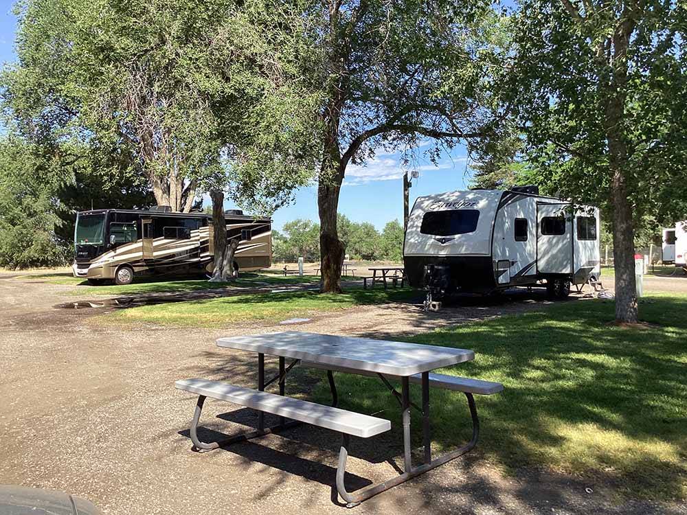 A picnic table at an RV site at VILLAGE OF TREES RV RESORT