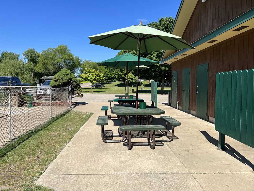 A set of covered patio tables at LANSING COTTONWOOD CAMPGROUND