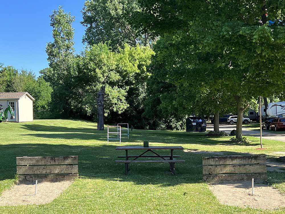 A picnic table and horseshoe pits at LANSING COTTONWOOD CAMPGROUND