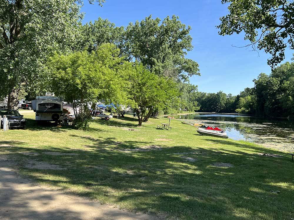 A group of grassy RV sites by the water at LANSING COTTONWOOD CAMPGROUND