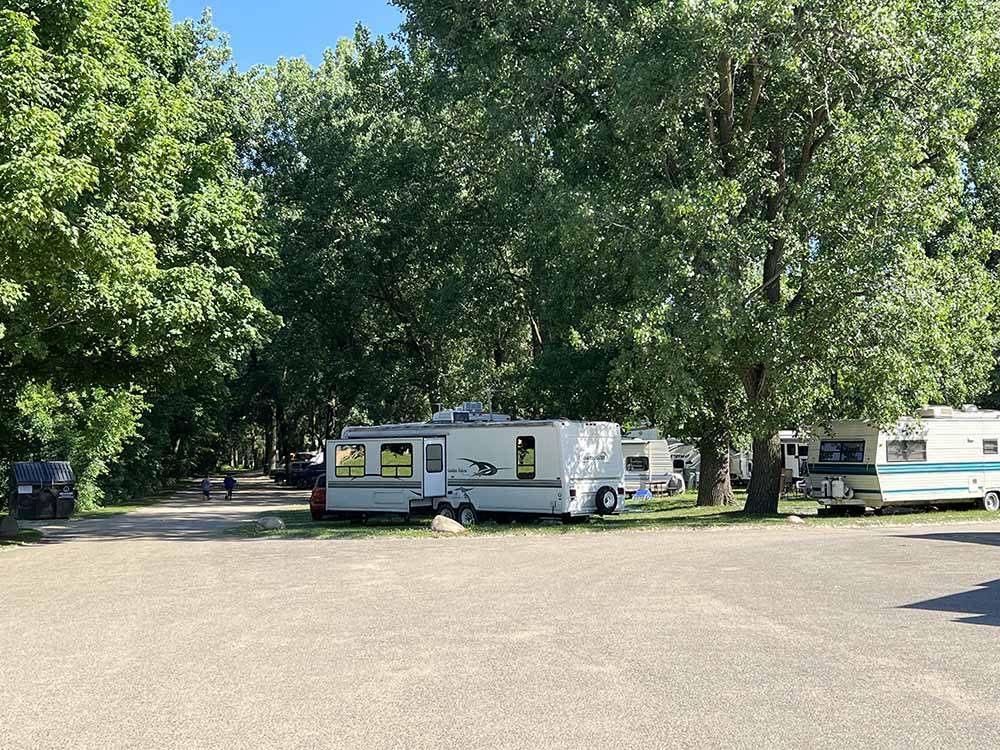 A group of trailers under trees at LANSING COTTONWOOD CAMPGROUND
