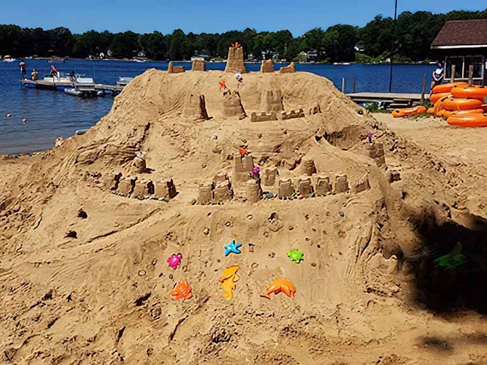 A large sandcastle on the beach at FULLER'S RESORT & CAMPGROUND ON CLEAR LAKE
