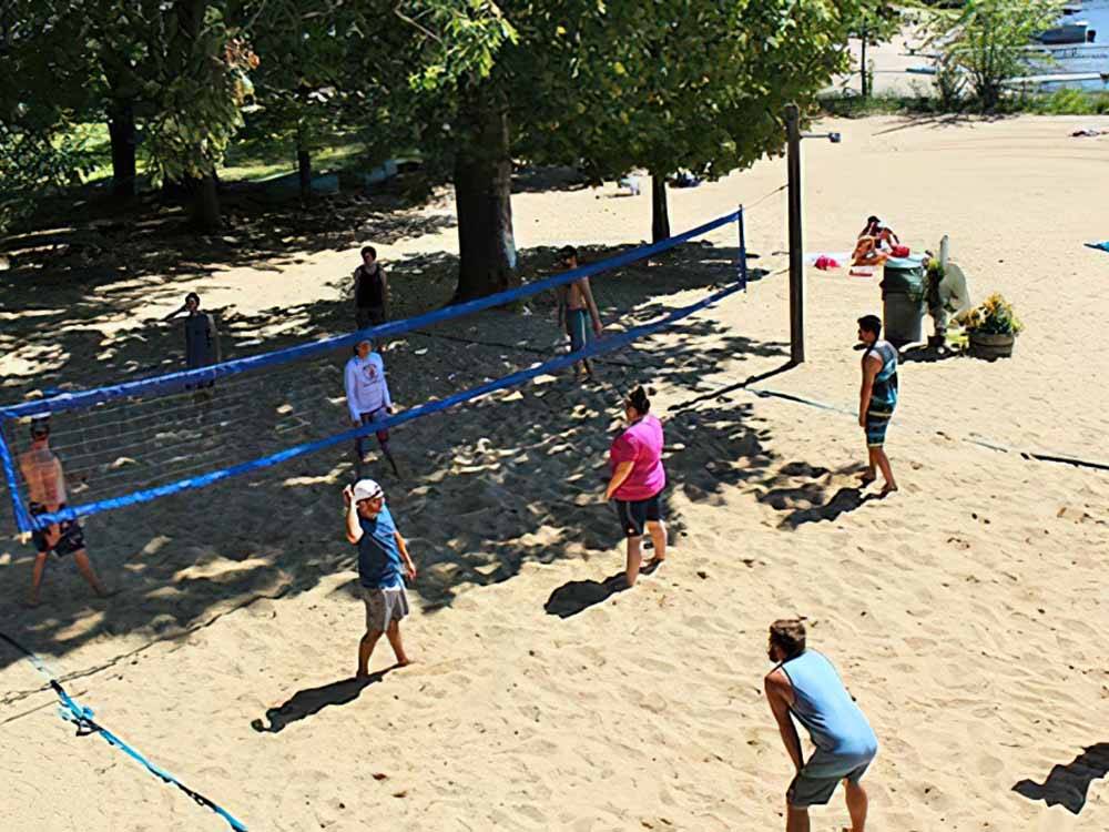 People playing beach volleyball at FULLER'S RESORT & CAMPGROUND ON CLEAR LAKE