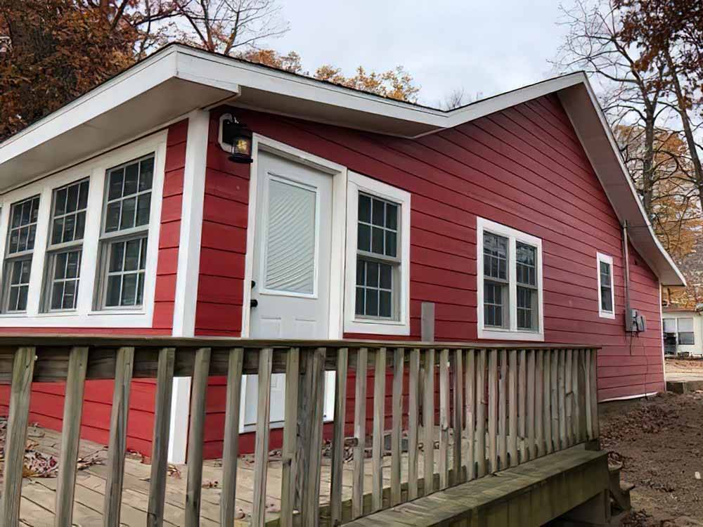 A red building with a deck at FULLER'S RESORT & CAMPGROUND ON CLEAR LAKE