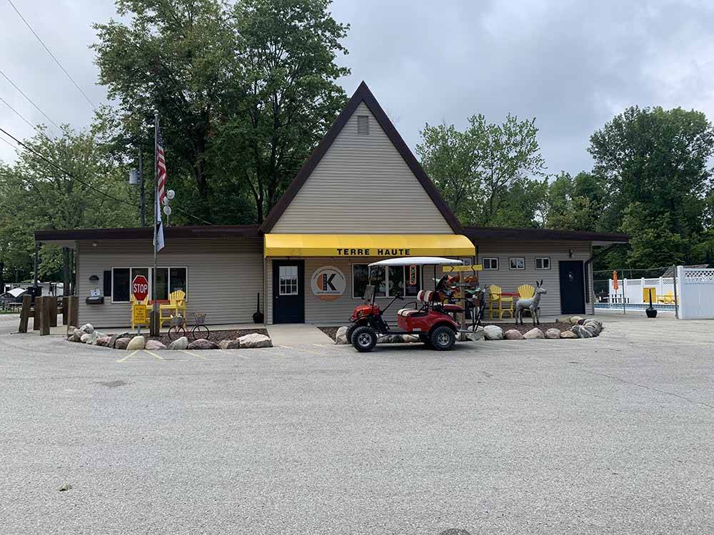 A golf cart parked in front of the office at TERRE HAUTE CAMPGROUND