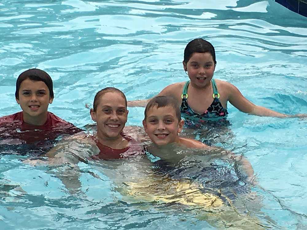 Four children in the swimming pool