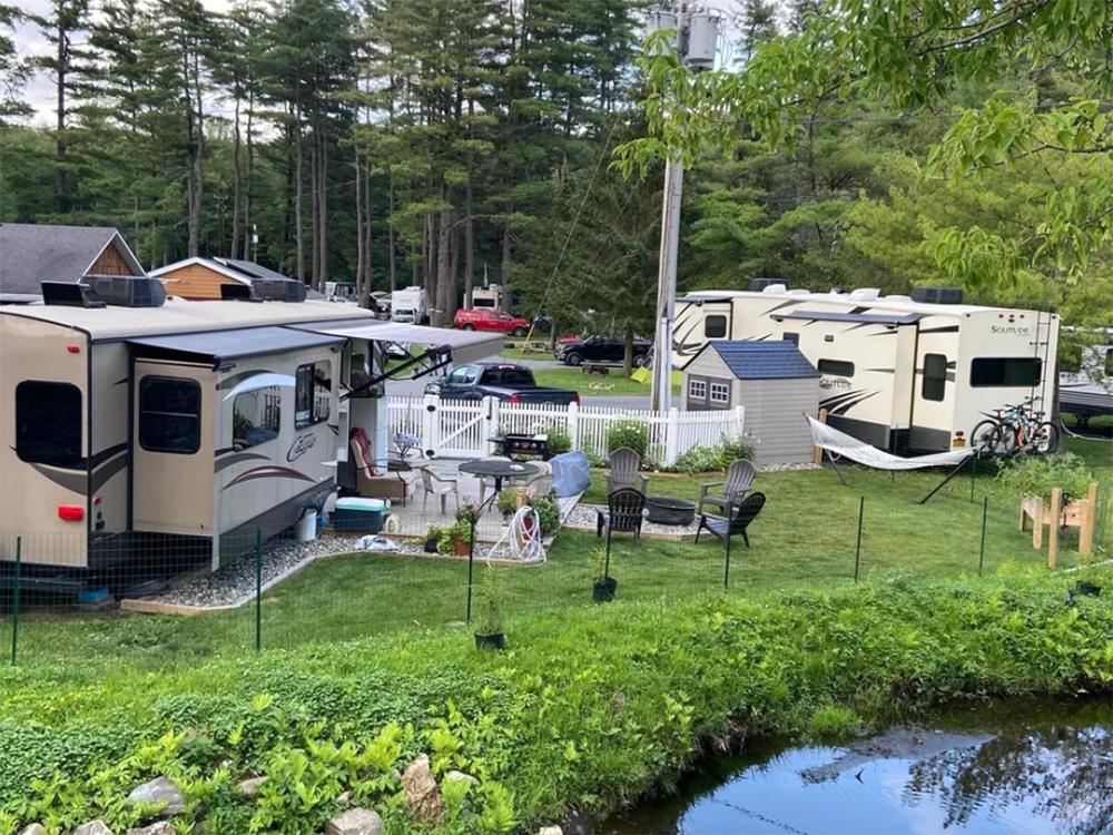 Long term RVs near the pong at WHIPPOORWILL MOTEL & CAMPSITES