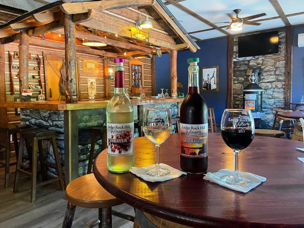 Local wines on the table at the rustic bar at WHIPPOORWILL MOTEL & CAMPSITES