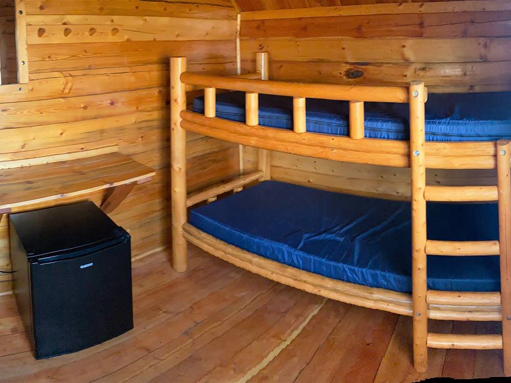 Bunk beds inside one of the cabins at LARAMIE RV RESORT BY RJOURNEY
