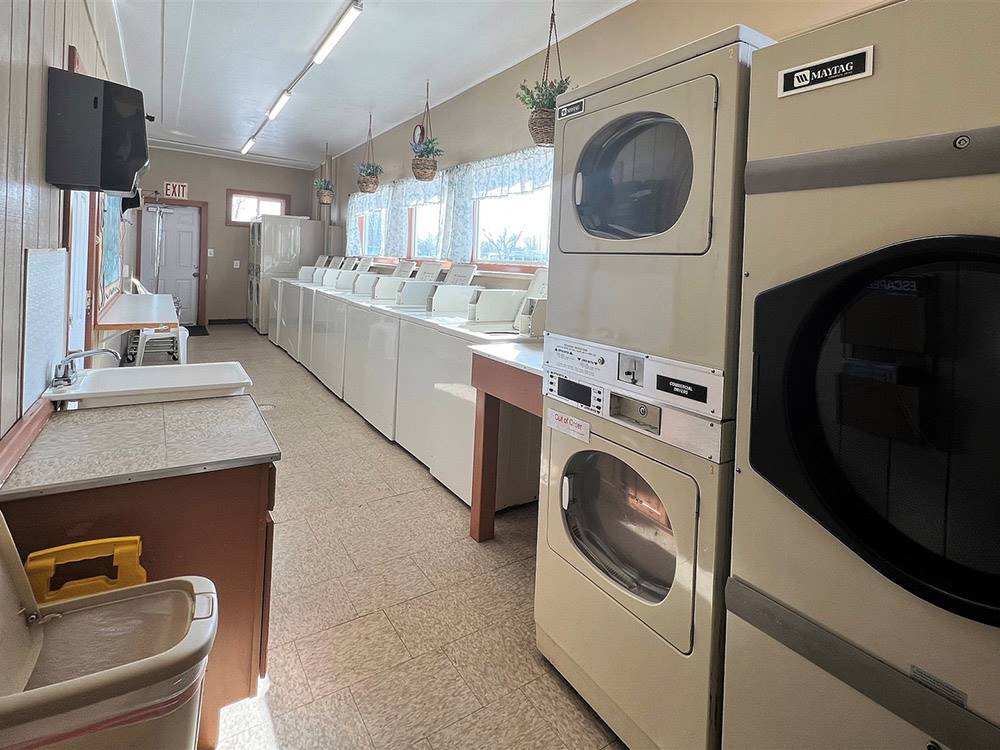 Washers and dryers in the laundry room at LARAMIE RV RESORT BY RJOURNEY