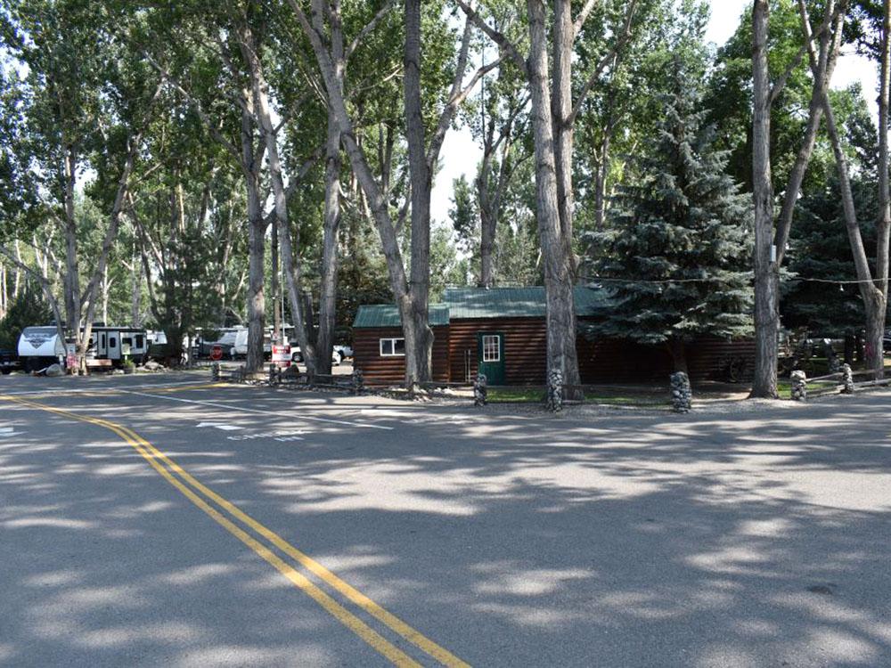 A cabin nestled in the woods at YELLOWSTONE RIVER RV PARK & CAMPGROUND