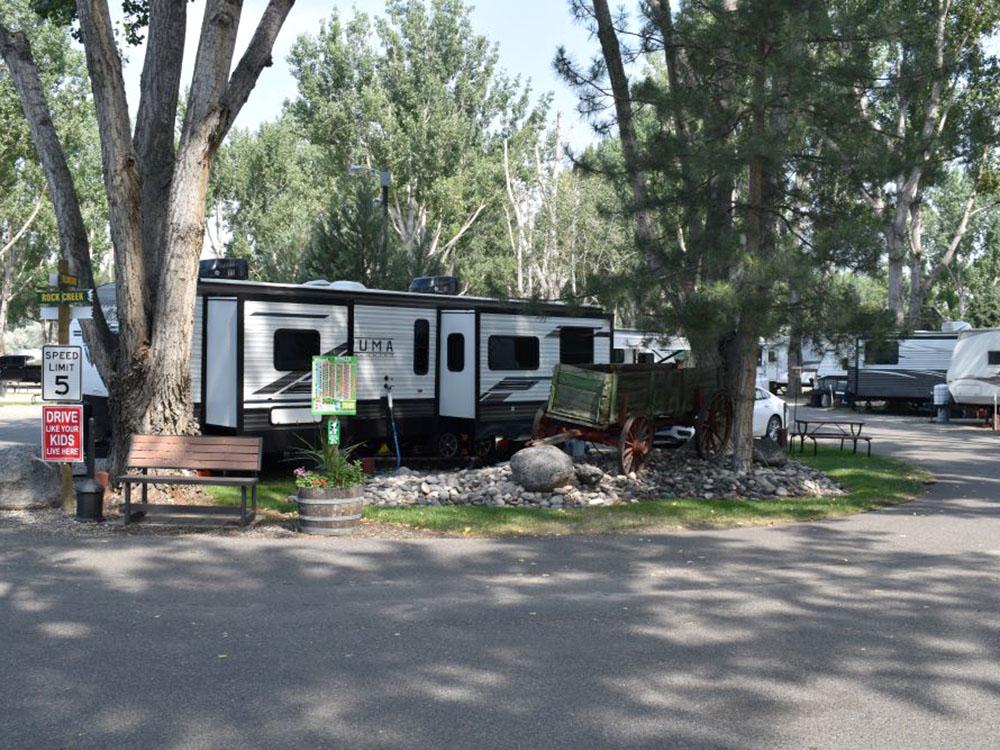 A large fifth whell with slide outs at site at YELLOWSTONE RIVER RV PARK & CAMPGROUND