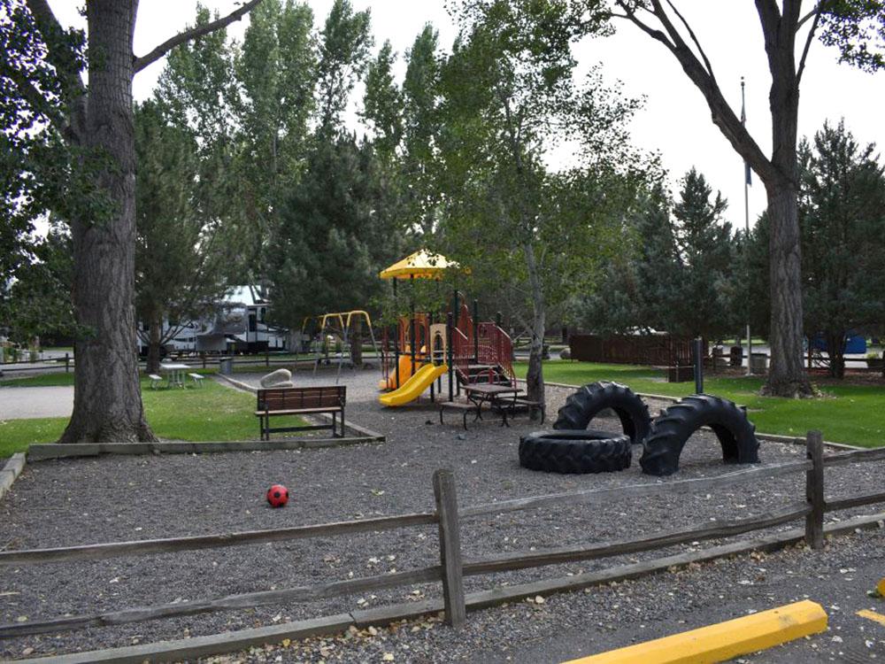 Play equipment at the playground at YELLOWSTONE RIVER RV PARK & CAMPGROUND