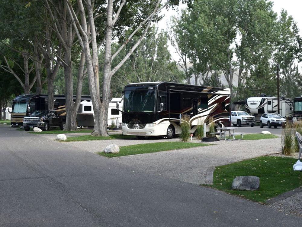 RVs in large pull-through sites at YELLOWSTONE RIVER RV PARK & CAMPGROUND