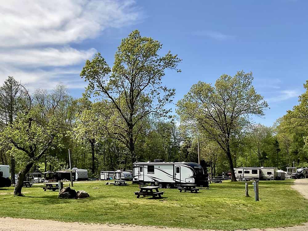 A group of grassy RV sites at SUNSETVIEW FARM CAMPING AREA