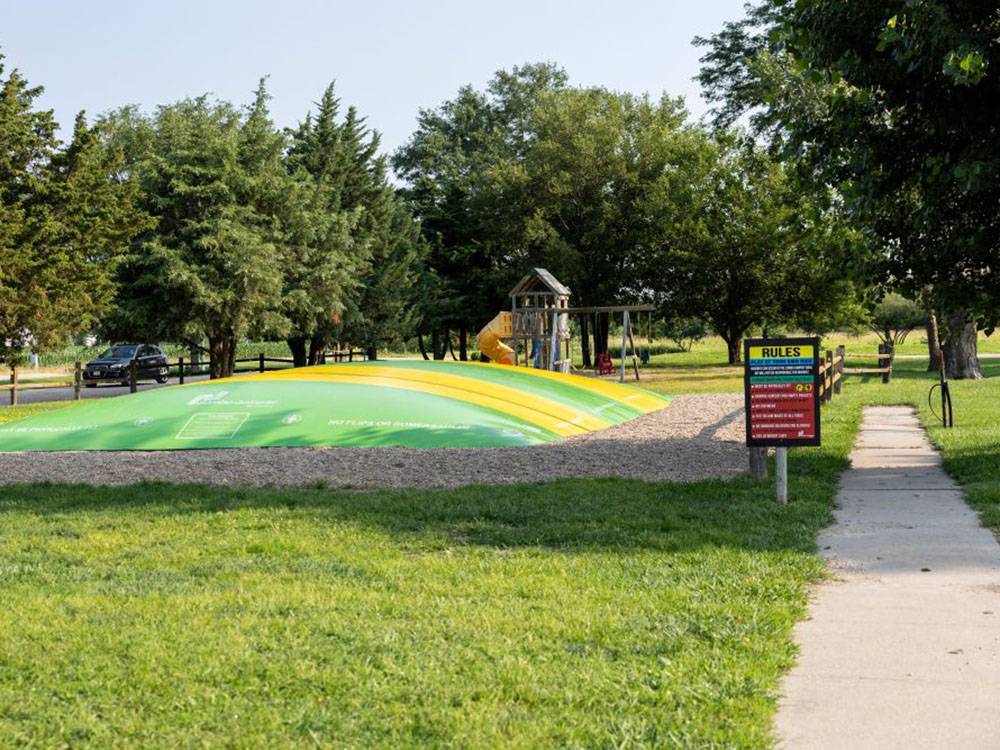 A green and yellow bounce pad