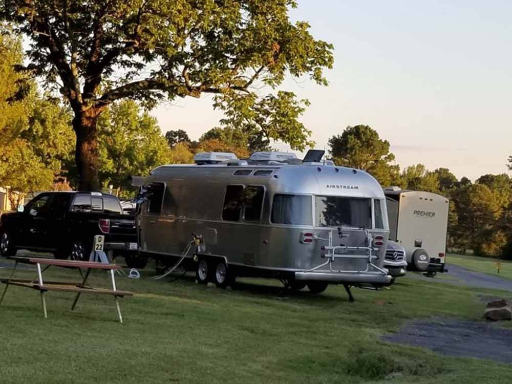 Airstream parked at campsite at FORT SMITH-ALMA RV PARK
