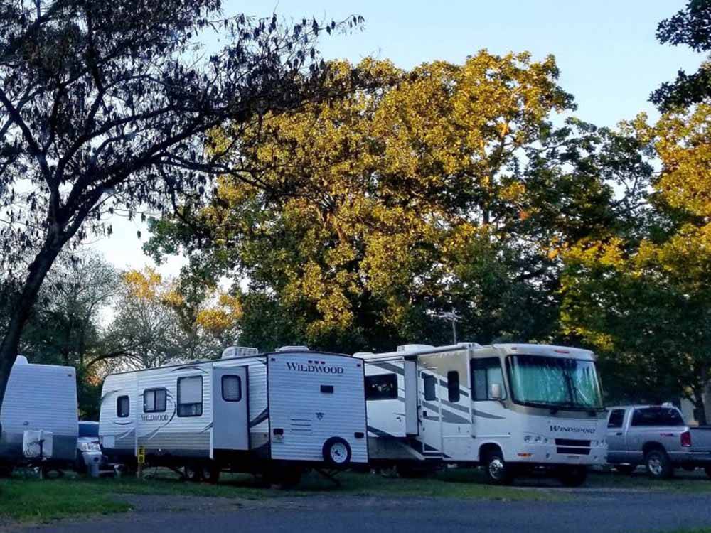 RVs parked at campsite at FORT SMITH-ALMA RV PARK